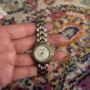 Fossil women’s watch. Opal background. Beautiful.
